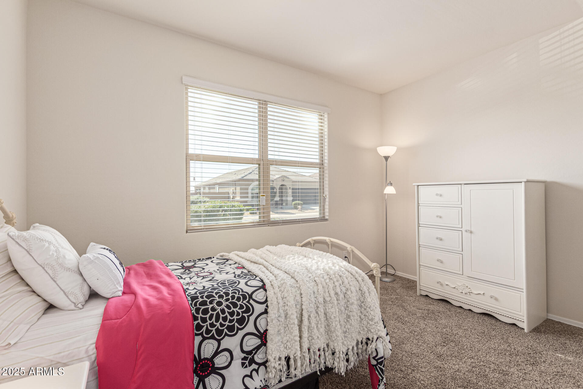41844 West Rosa Drive Maricopa, AZ 85138 - Photo 7 of 47 a bedroom with a bed and a window