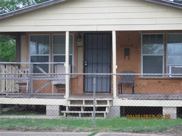 a view of a house with a large window