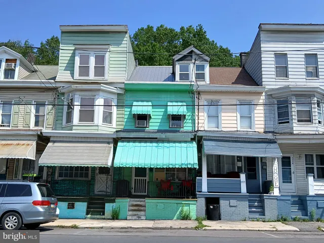 a front view of a building with street view