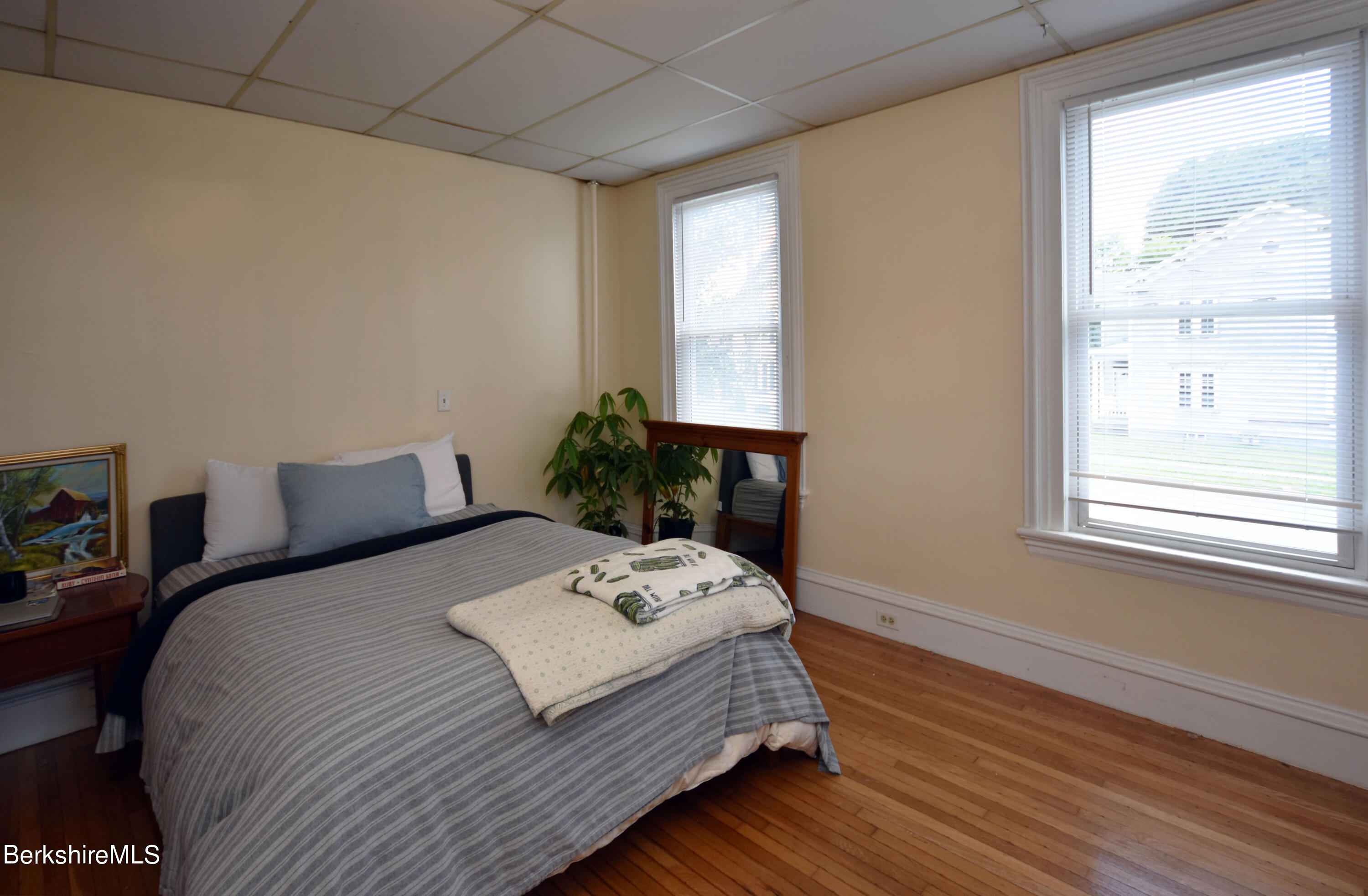 26 Elizabeth Street Pittsfield, MA 01201 - Photo 16 of 43 a bedroom with a bed table and window