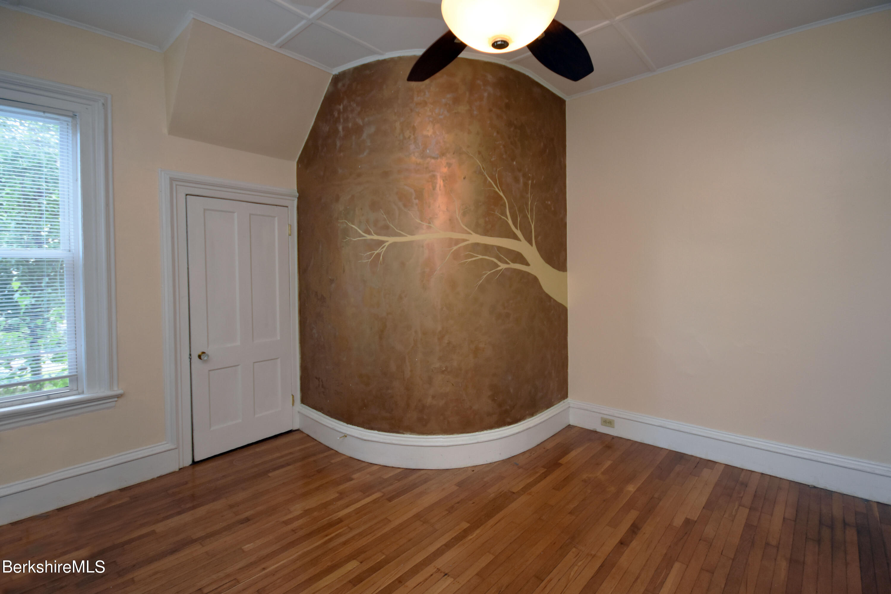 26 Elizabeth Street Pittsfield, MA 01201 - Photo 17 of 43 an empty room with wooden floor and windows
