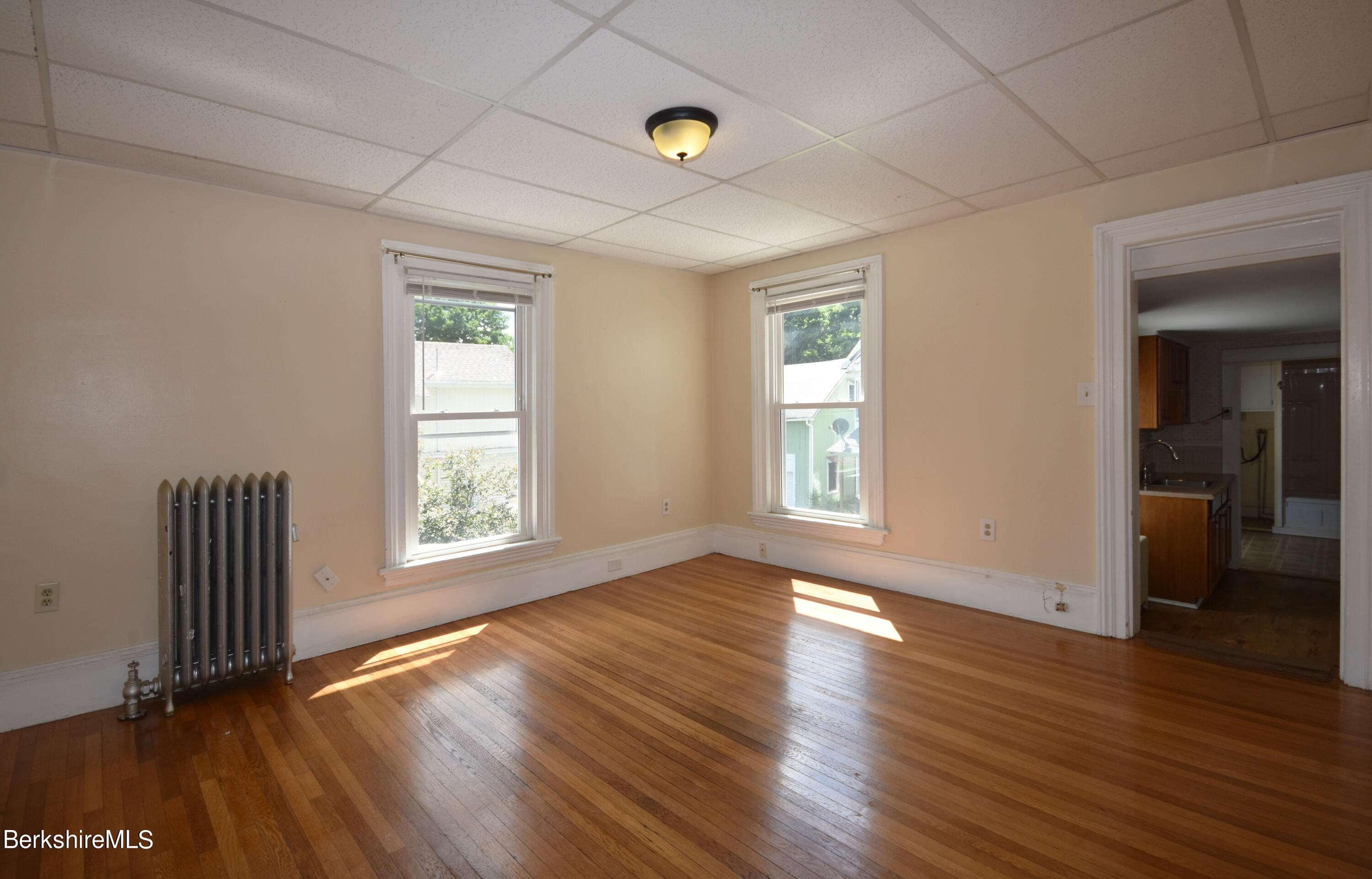 26 Elizabeth Street Pittsfield, MA 01201 - Photo 20 of 43 an empty room with wooden floor and windows