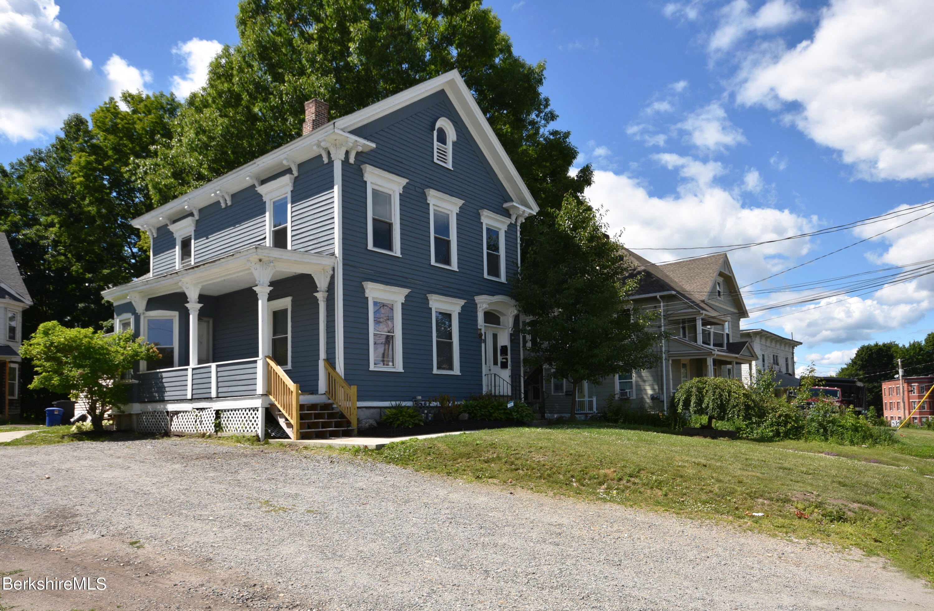 26 Elizabeth Street Pittsfield, MA 01201 - Photo 2 of 43 a view of a house with a yard and plants