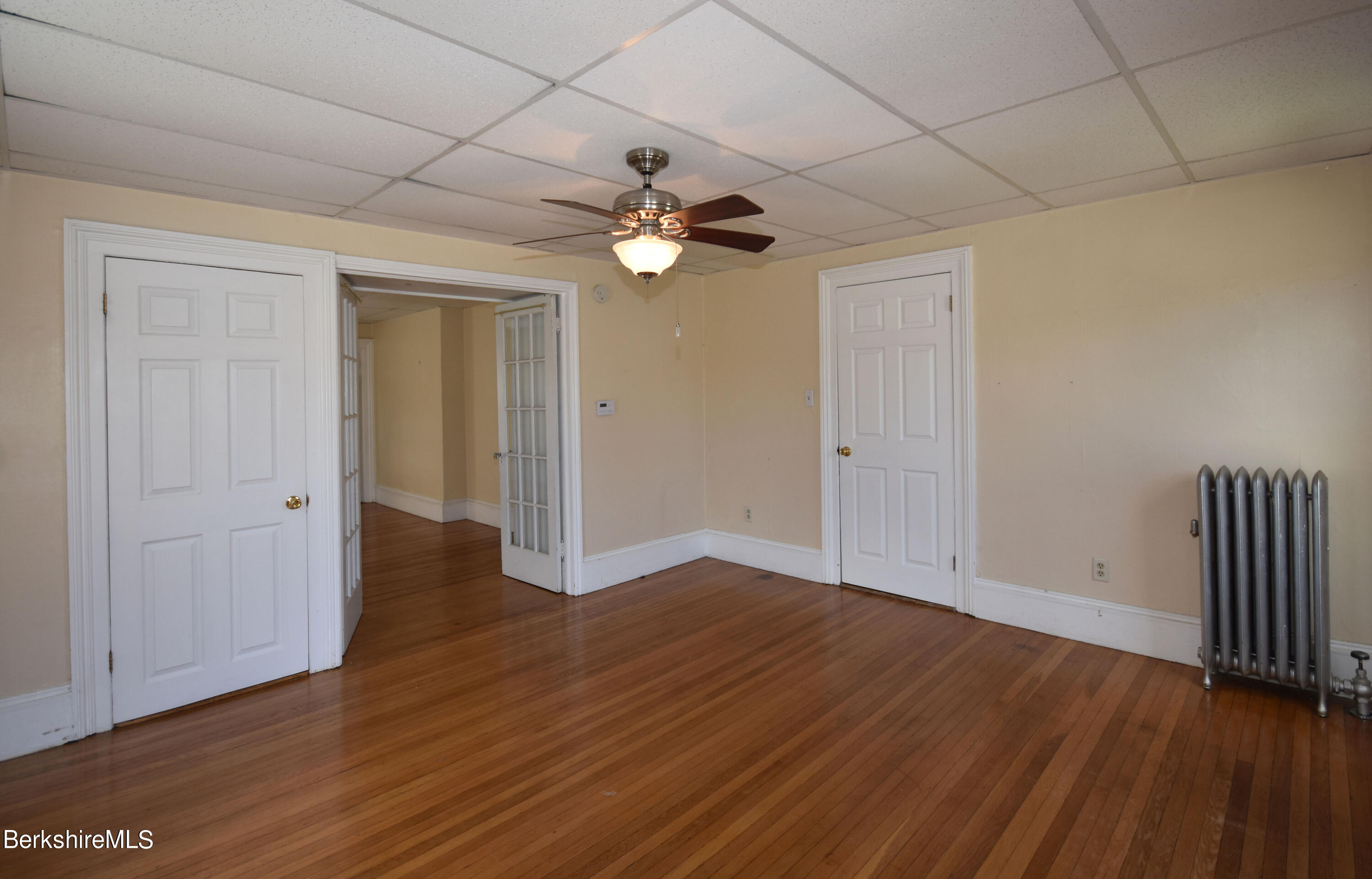26 Elizabeth Street Pittsfield, MA 01201 - Photo 30 of 43 wooden floor in an empty room with a window