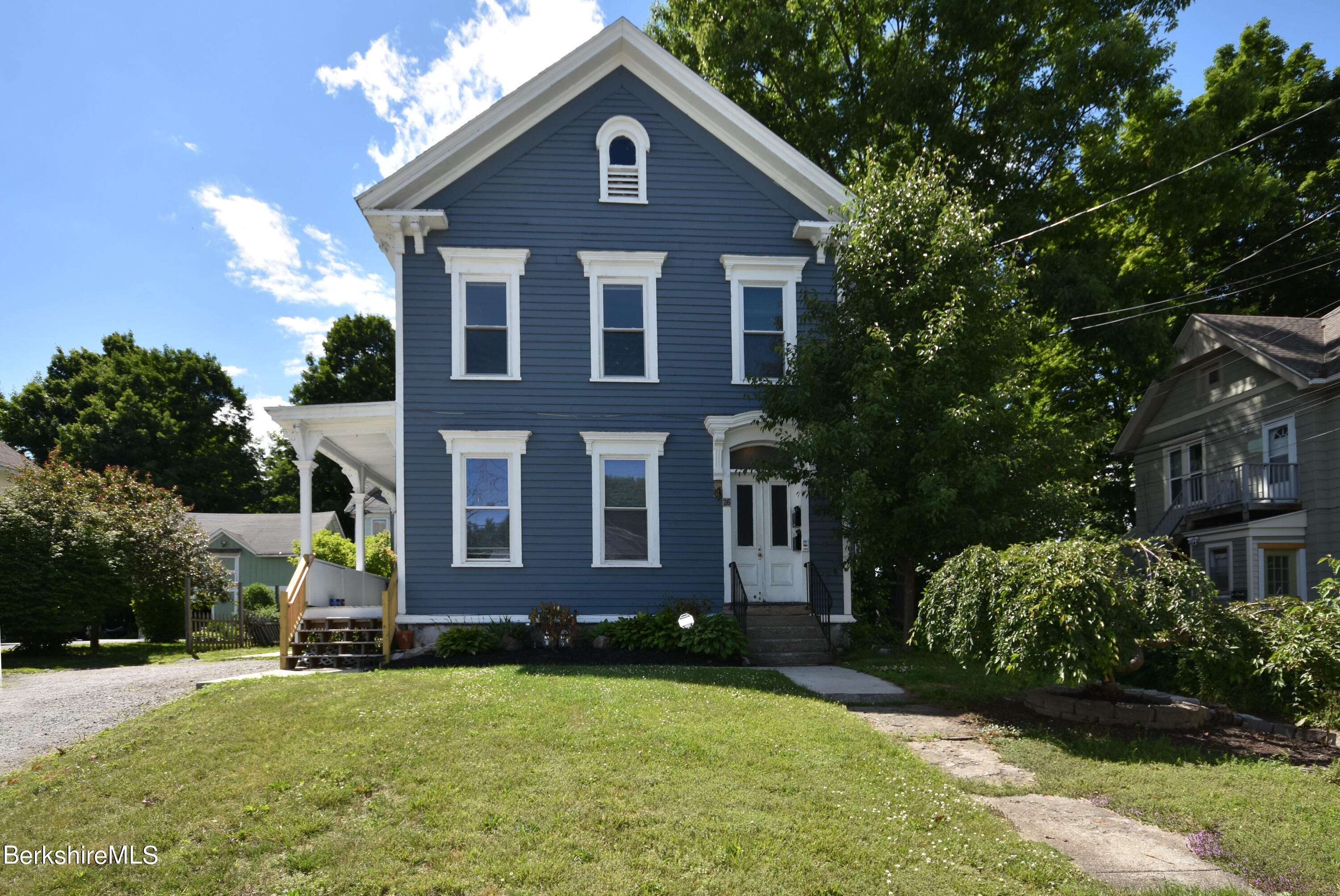 26 Elizabeth Street Pittsfield, MA 01201 - Photo 3 of 43 a front view of a house with a yard