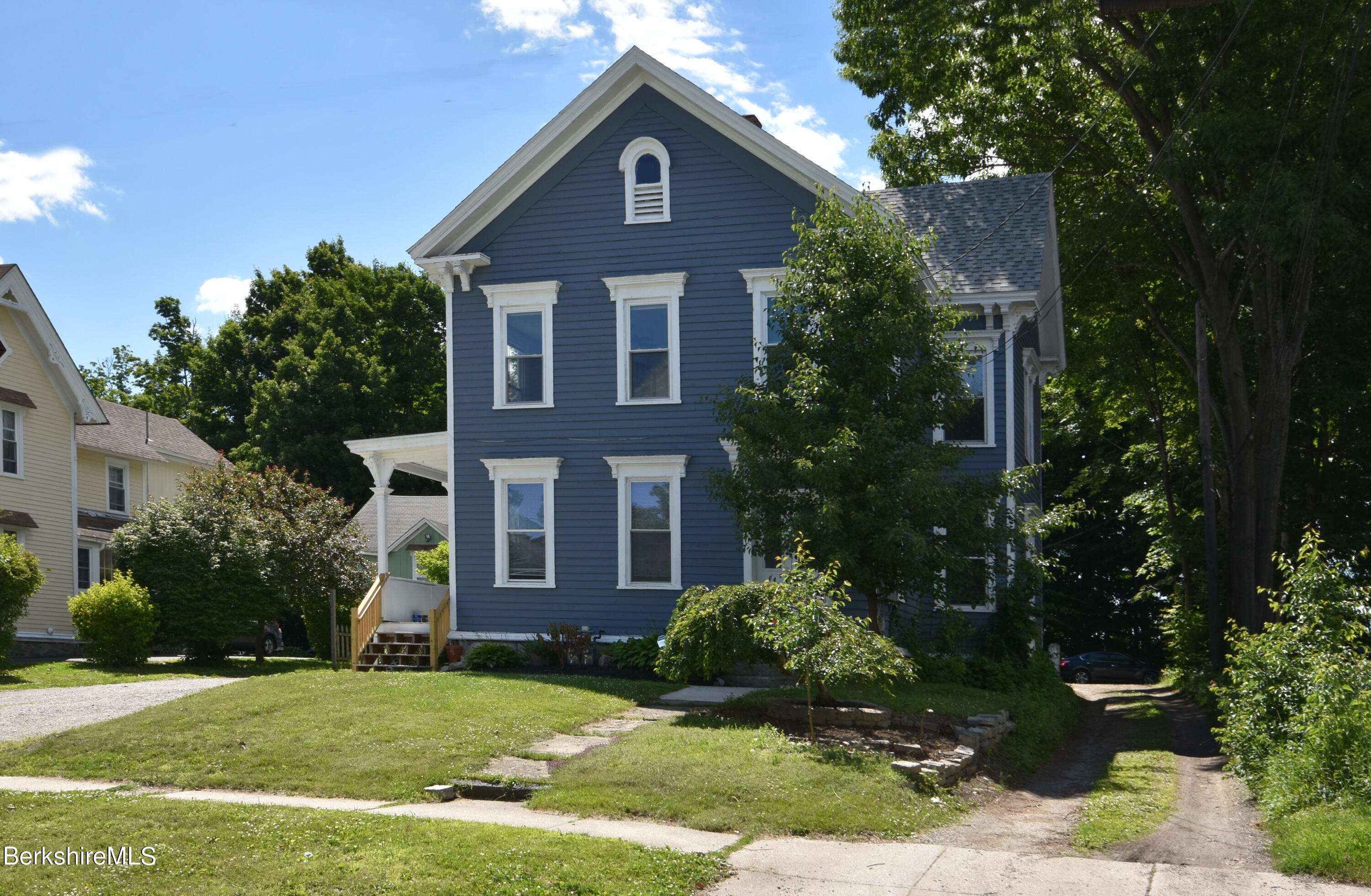 26 Elizabeth Street Pittsfield, MA 01201 - Photo 4 of 43 a front view of a house with a yard