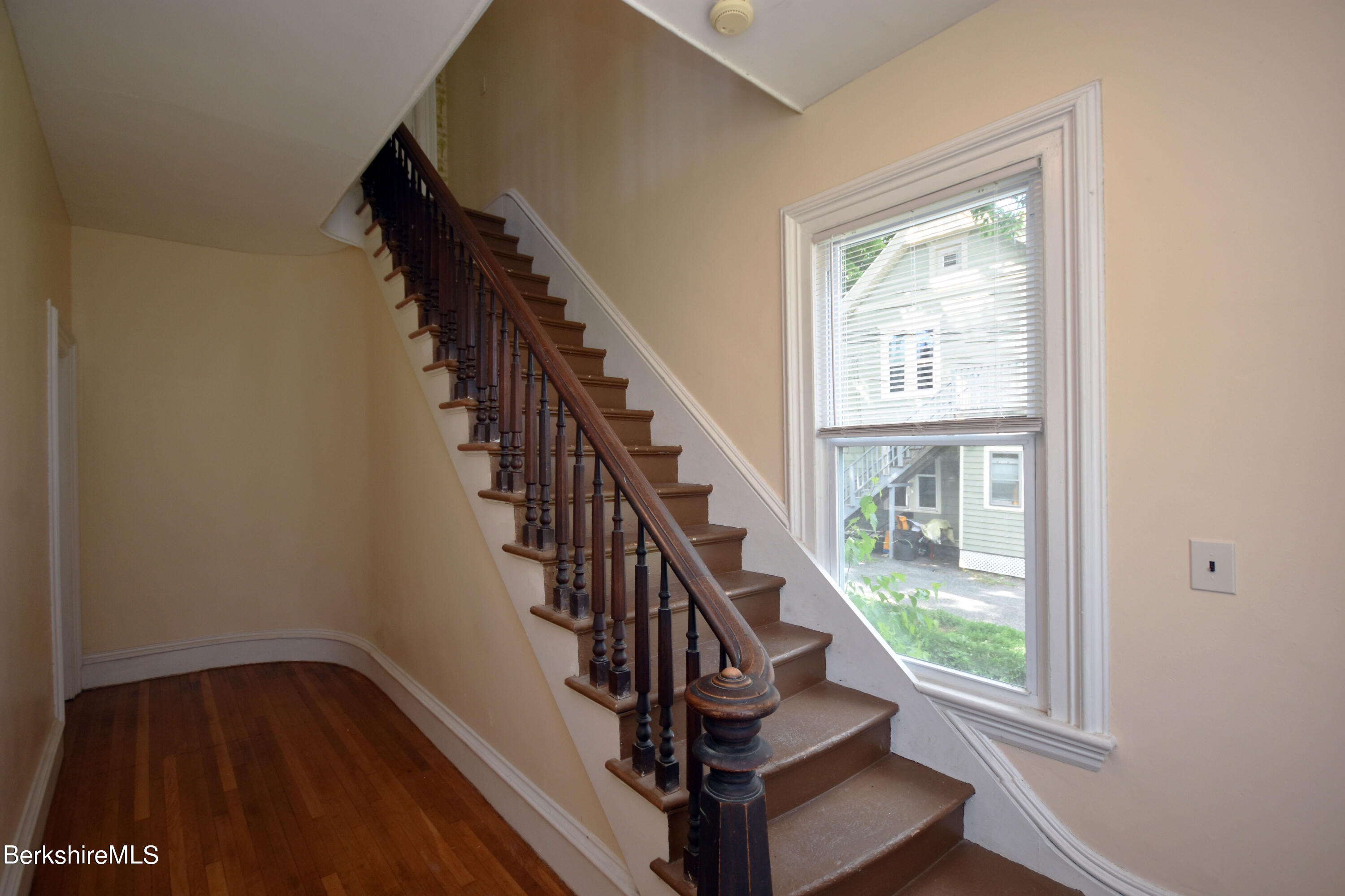 26 Elizabeth Street Pittsfield, MA 01201 - Photo 6 of 43 a view of entryway and hall with wooden floor