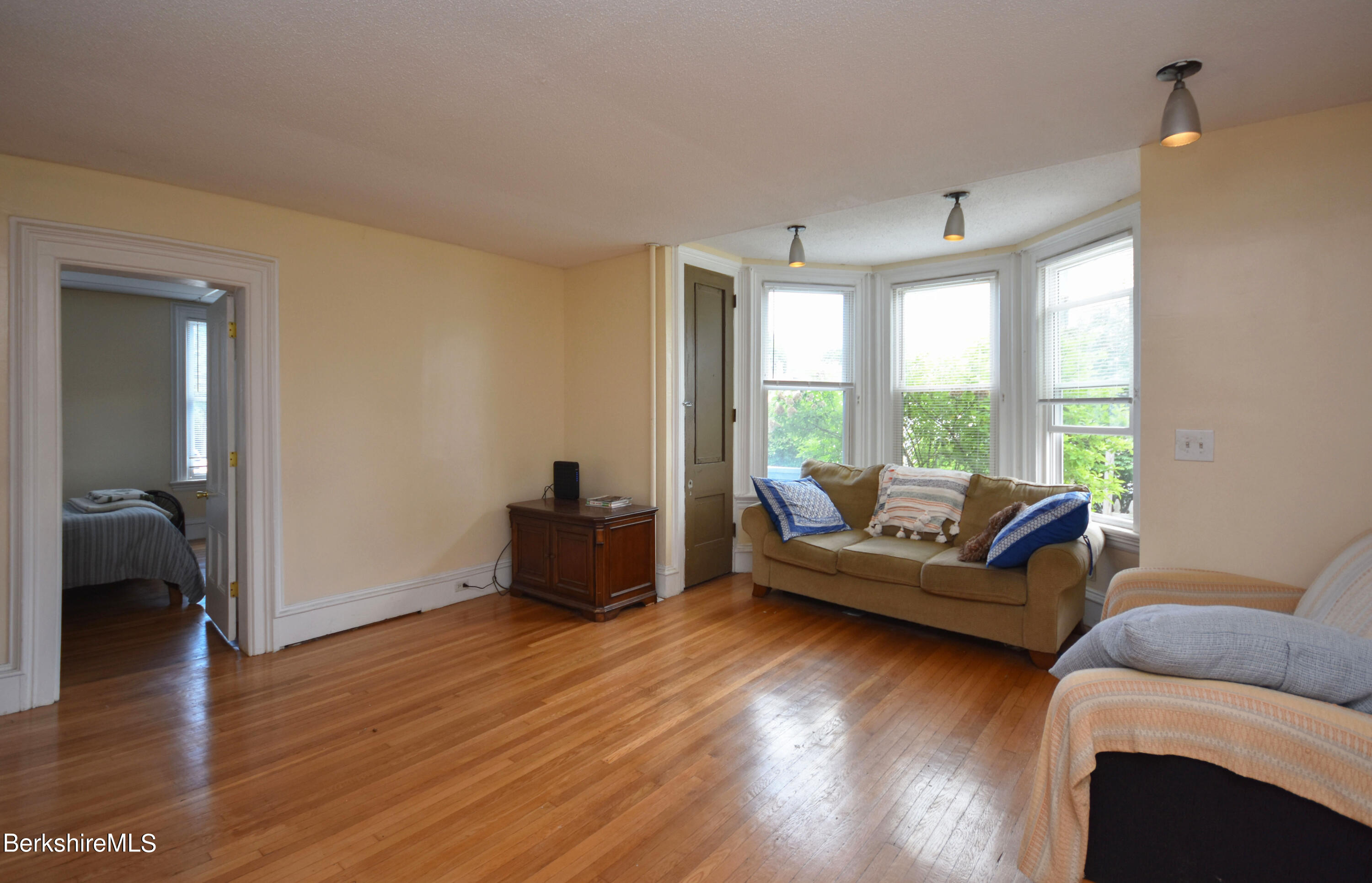 26 Elizabeth Street Pittsfield, MA 01201 - Photo 7 of 43 a living room with furniture and a large window
