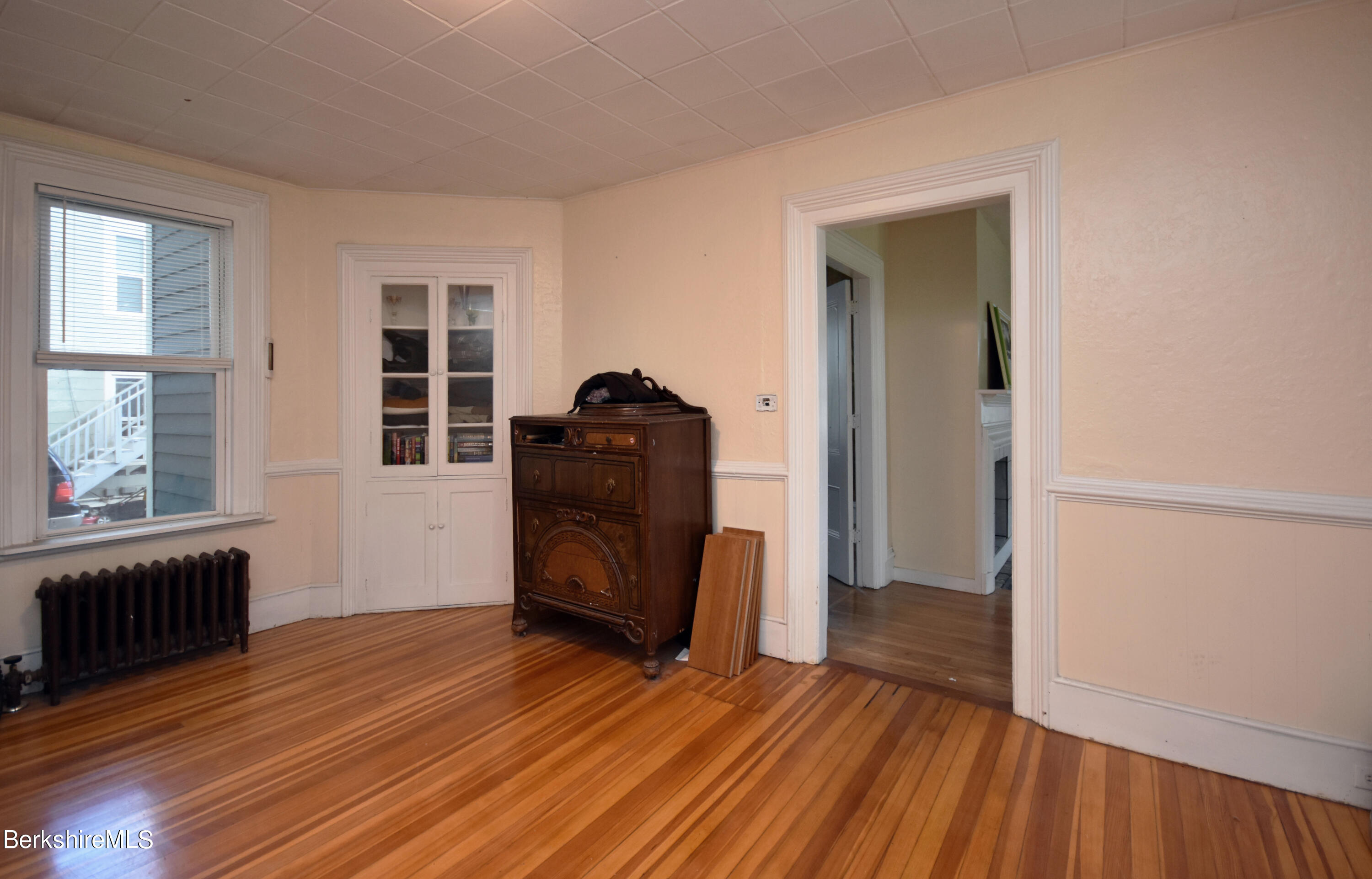 26 Elizabeth Street Pittsfield, MA 01201 - Photo 9 of 43 an empty room with wooden floor and windows