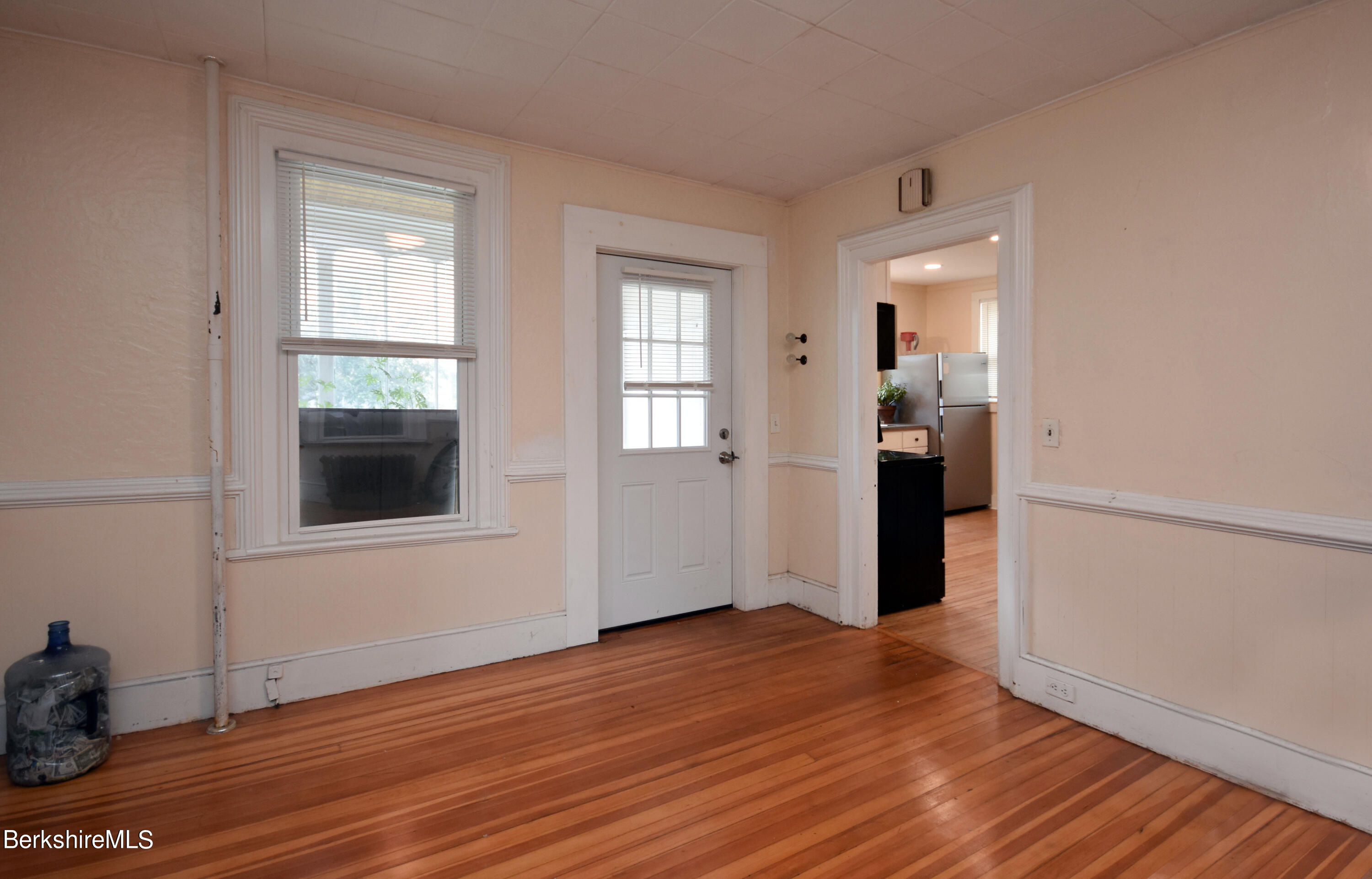 26 Elizabeth Street Pittsfield, MA 01201 - Photo 10 of 43 an empty room with wooden floor and windows