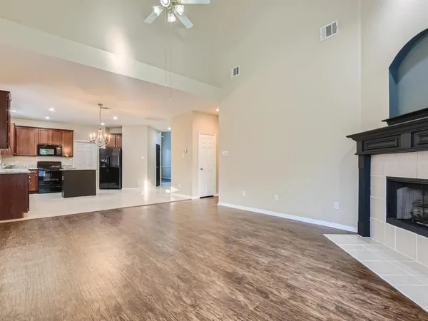 a view of a kitchen with a stove cabinets and wooden floor