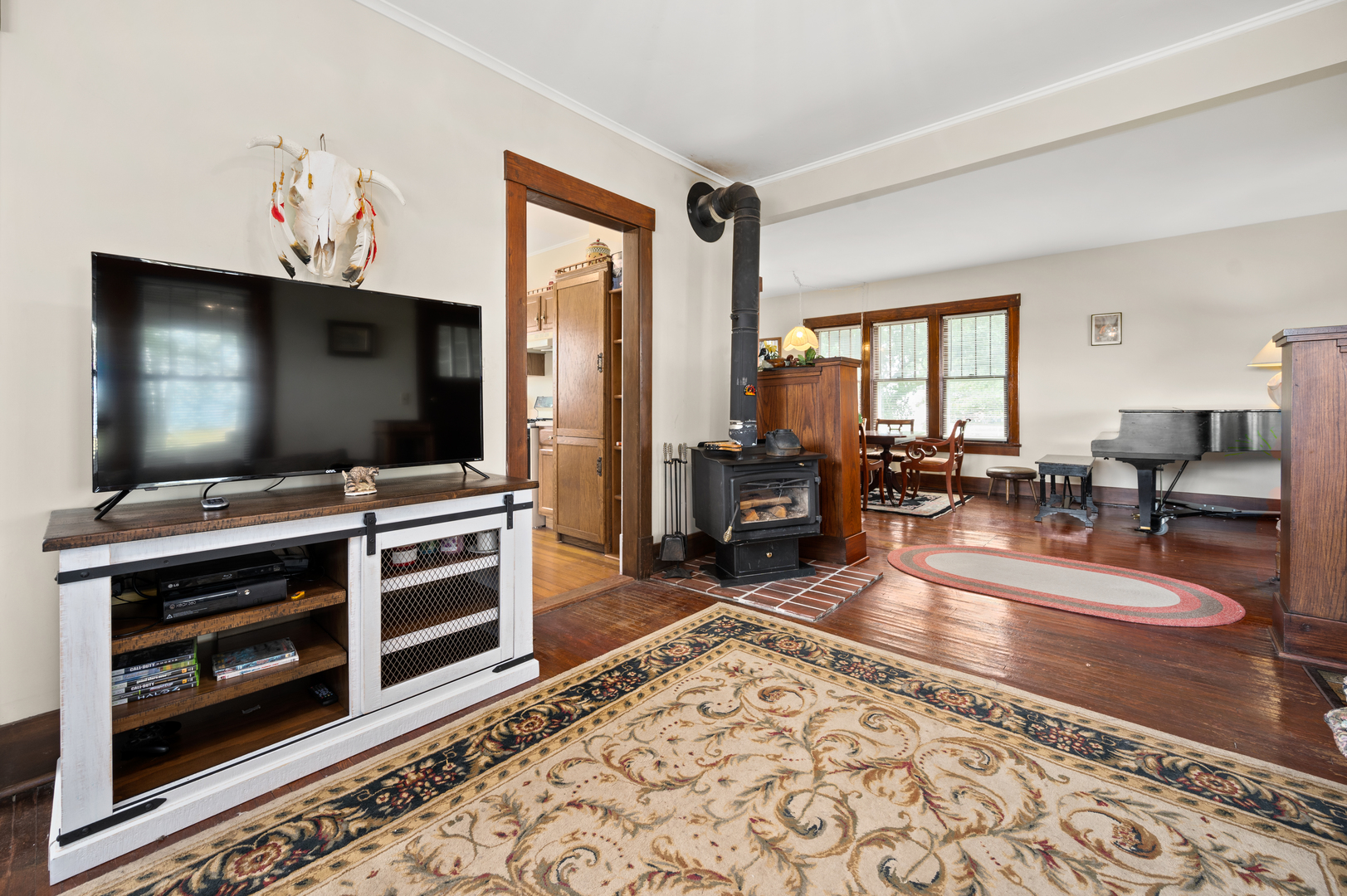 15346 Quigley Road Sycamore, IL 60178 - Photo 24 of 42 a living room with furniture and a flat screen tv