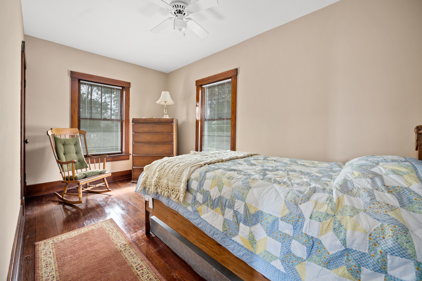15346 Quigley Road Sycamore, IL 60178 - Photo 32 of 42 a bedroom with a bed a chair and a large window