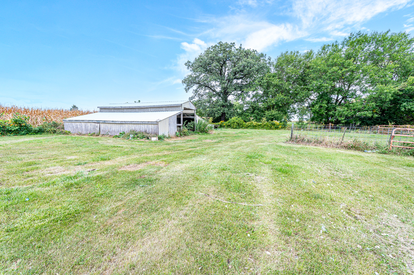 15346 Quigley Road Sycamore, IL 60178 - Photo 39 of 42 a backyard of a house with lots of green space