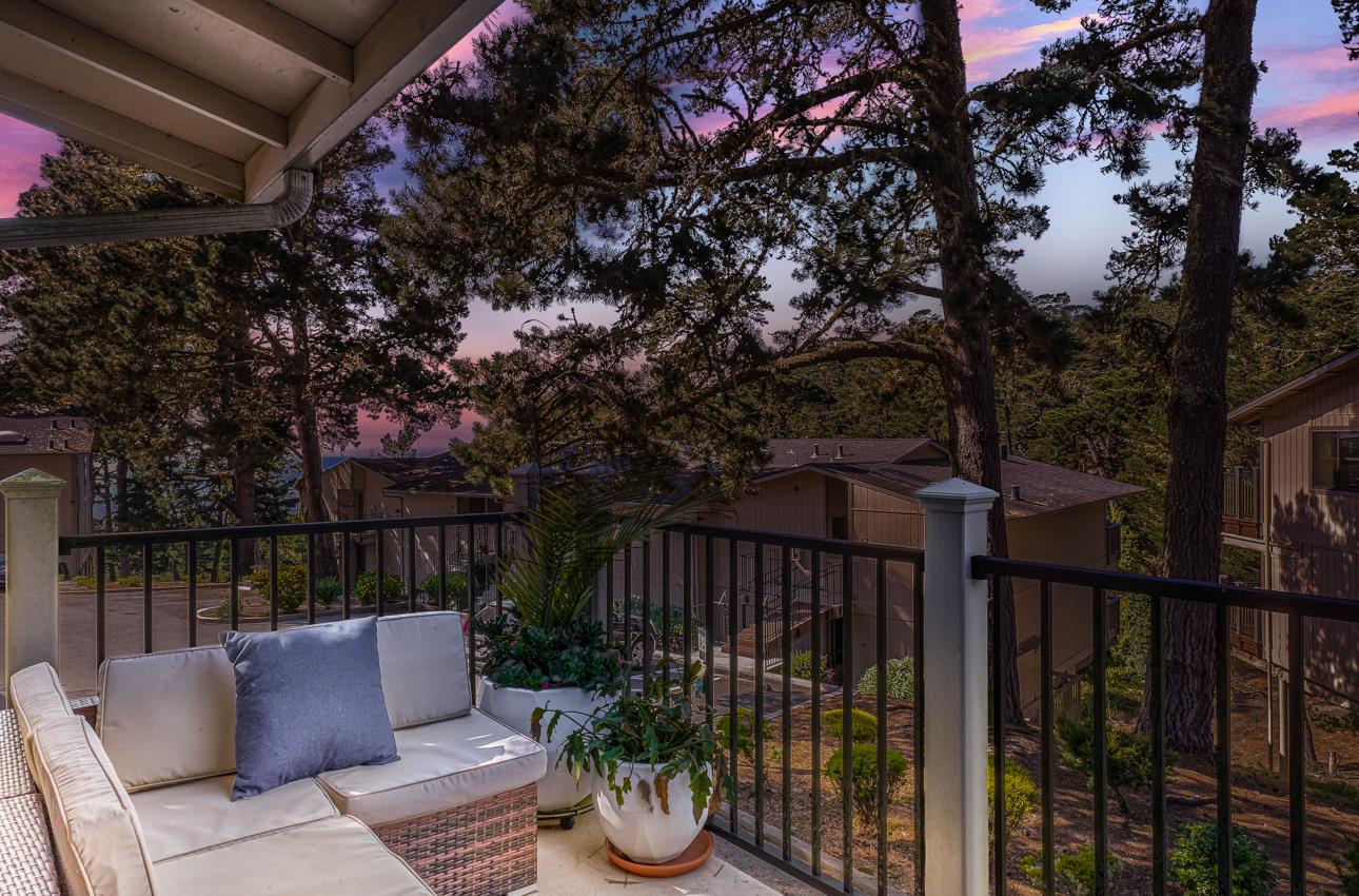 250 Forest Ridge Road, Unit 73 Monterey, CA 93940 - Photo 14 of 35 a roof deck with couches and wooden fence