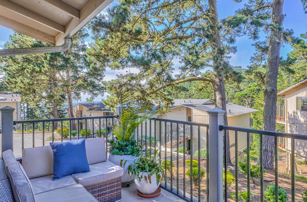 250 Forest Ridge Road, Unit 73 Monterey, CA 93940 - Photo 19 of 35 a roof deck with couches and wooden fence