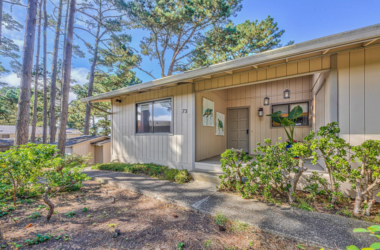 250 Forest Ridge Road, Unit 73 Monterey, CA 93940 - Photo 2 of 35 a front view of a house with garden