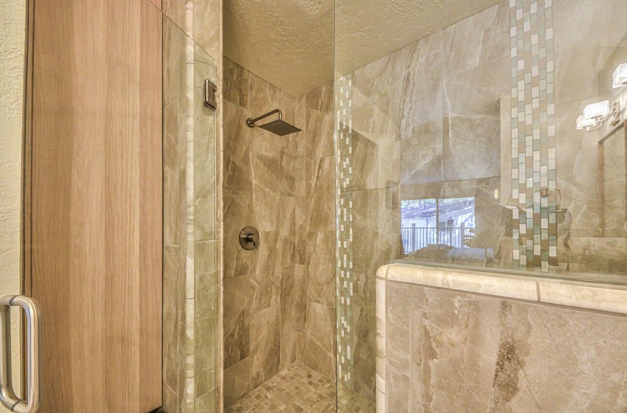 250 Forest Ridge Road, Unit 73 Monterey, CA 93940 - Photo 21 of 35 a bathroom with a granite countertop sink