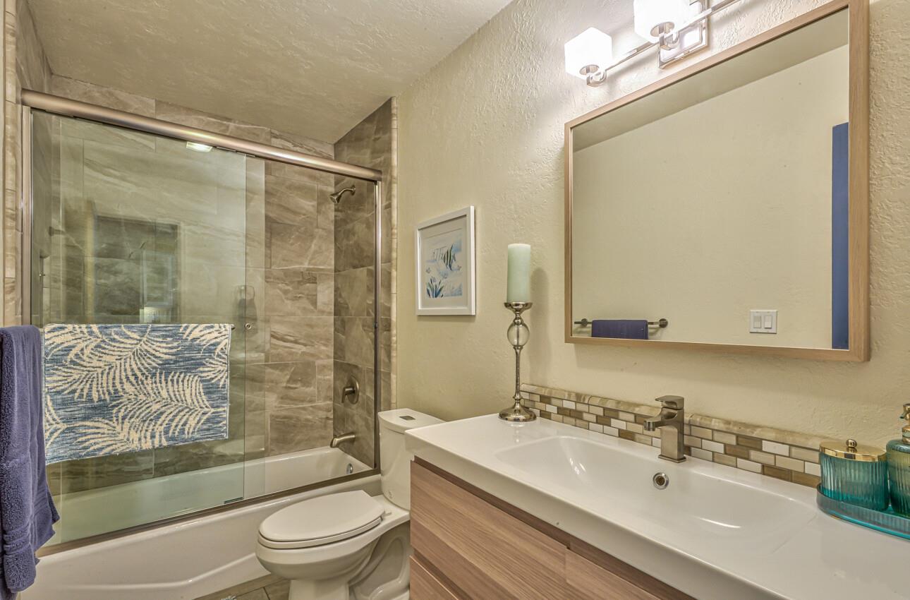 250 Forest Ridge Road, Unit 73 Monterey, CA 93940 - Photo 27 of 35 a bathroom with a sink mirror toilet and bathtub