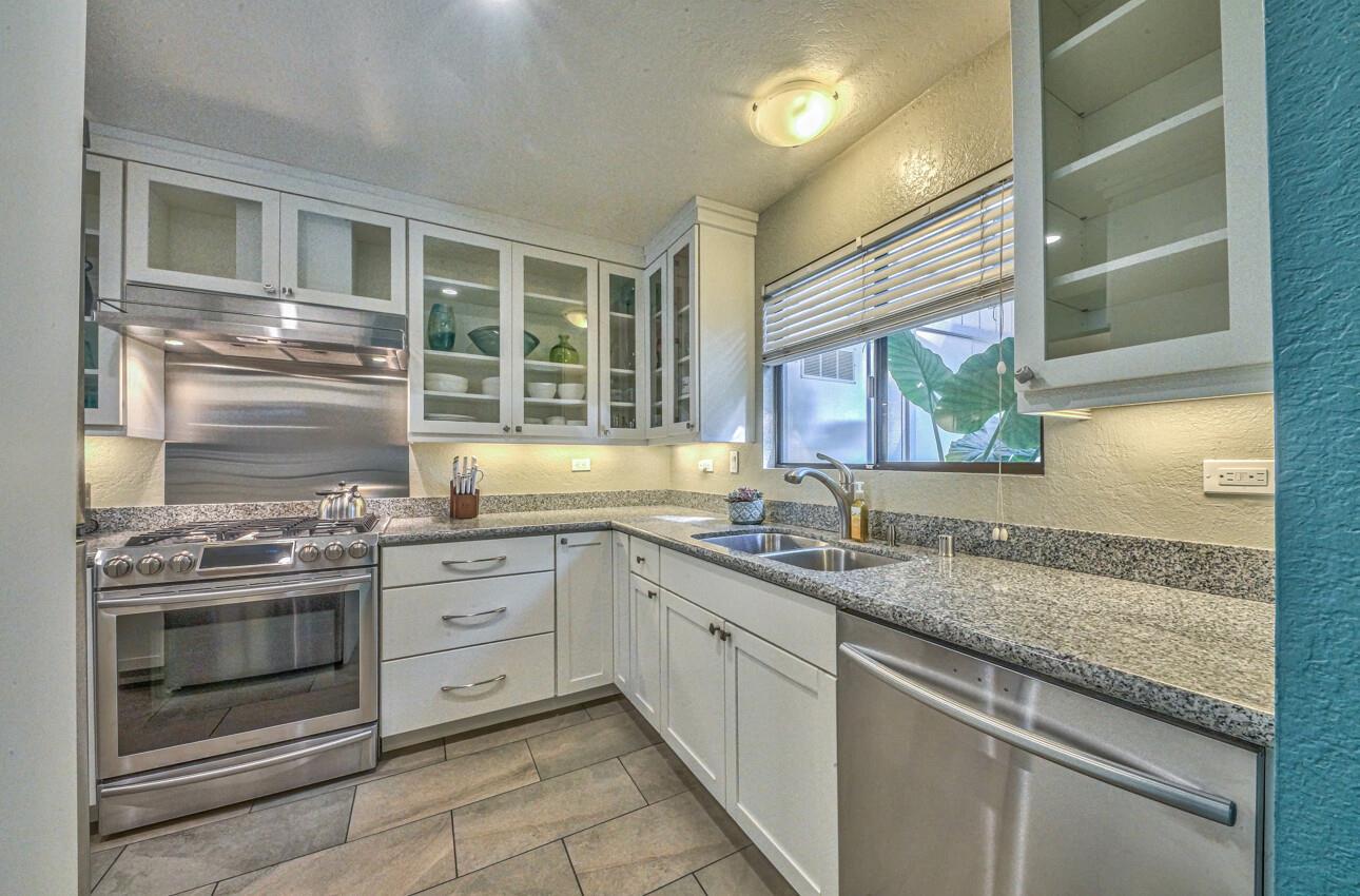 250 Forest Ridge Road, Unit 73 Monterey, CA 93940 - Photo 5 of 35 a kitchen with granite countertop stainless steel appliances and sink