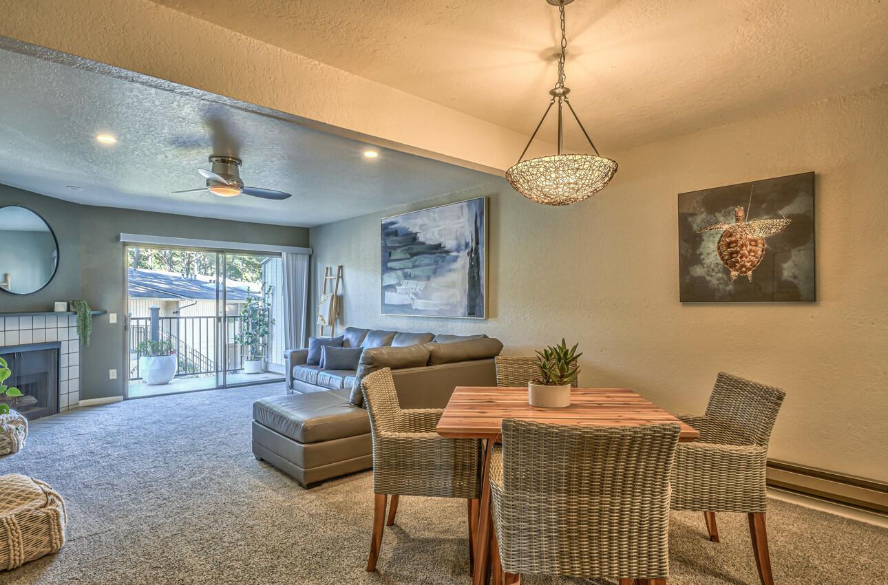 250 Forest Ridge Road, Unit 73 Monterey, CA 93940 - Photo 9 of 35 a living room with furniture a window and a chandelier