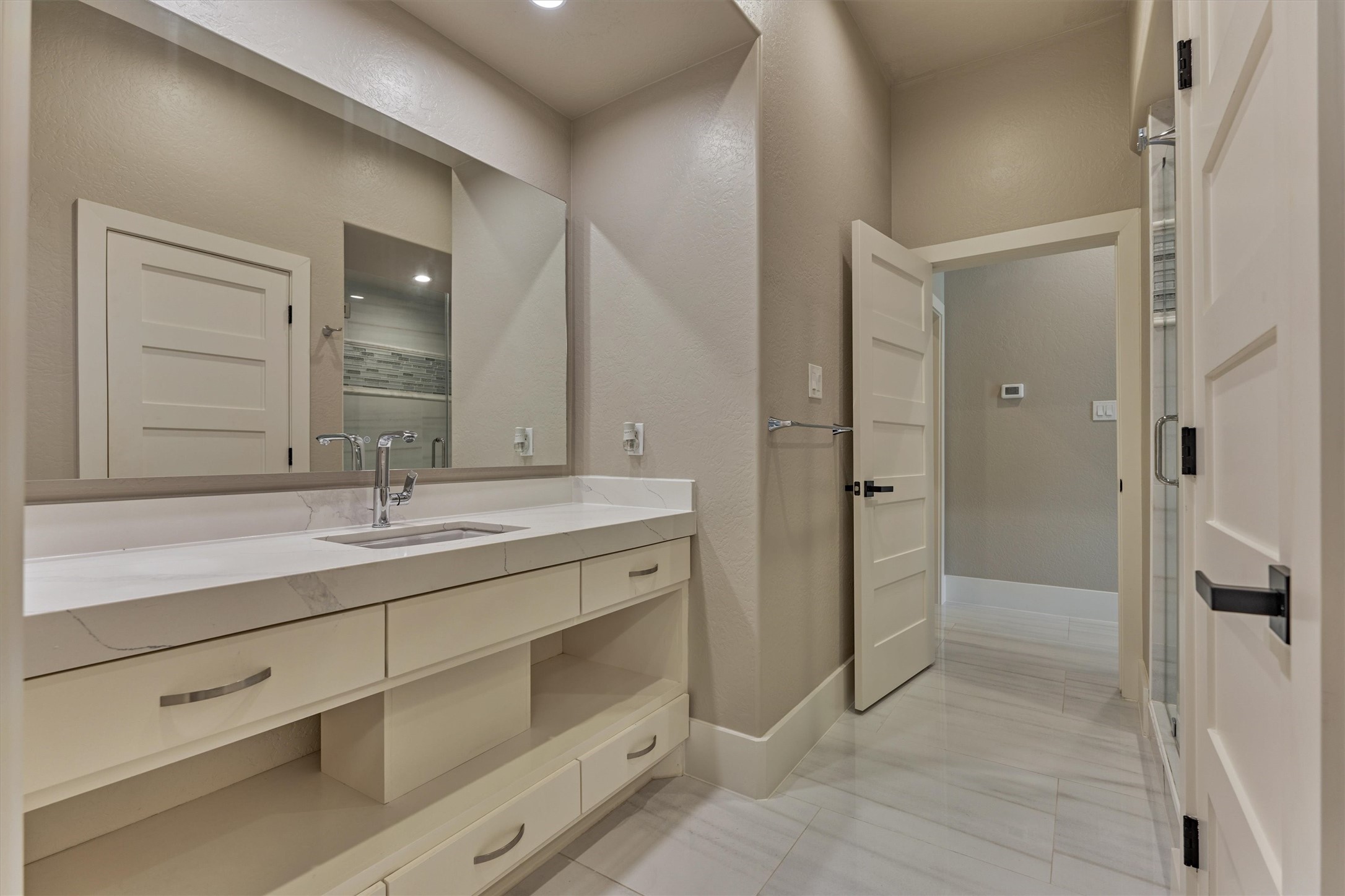 1907 Woerner Road Houston, TX 77090 - Photo 43 of 50 Bathroom with walk-in shower and convenient access to living room and bedroom.