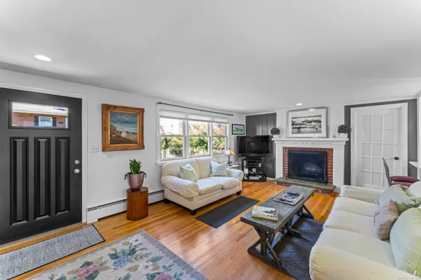 a living room with furniture rug and window