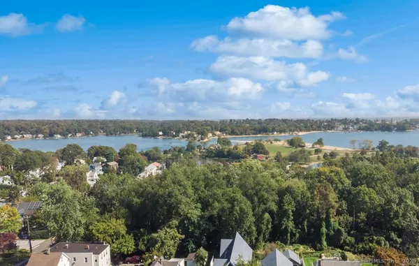 a view of a lake with houses in the back