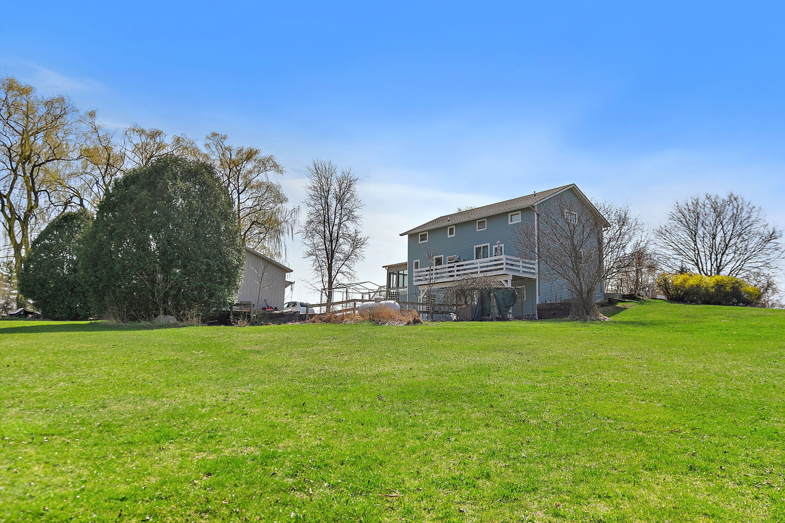 9602 Wright Road Harvard, IL 60033 - Photo 20 of 26 a backyard of a house with lots of green space and garden