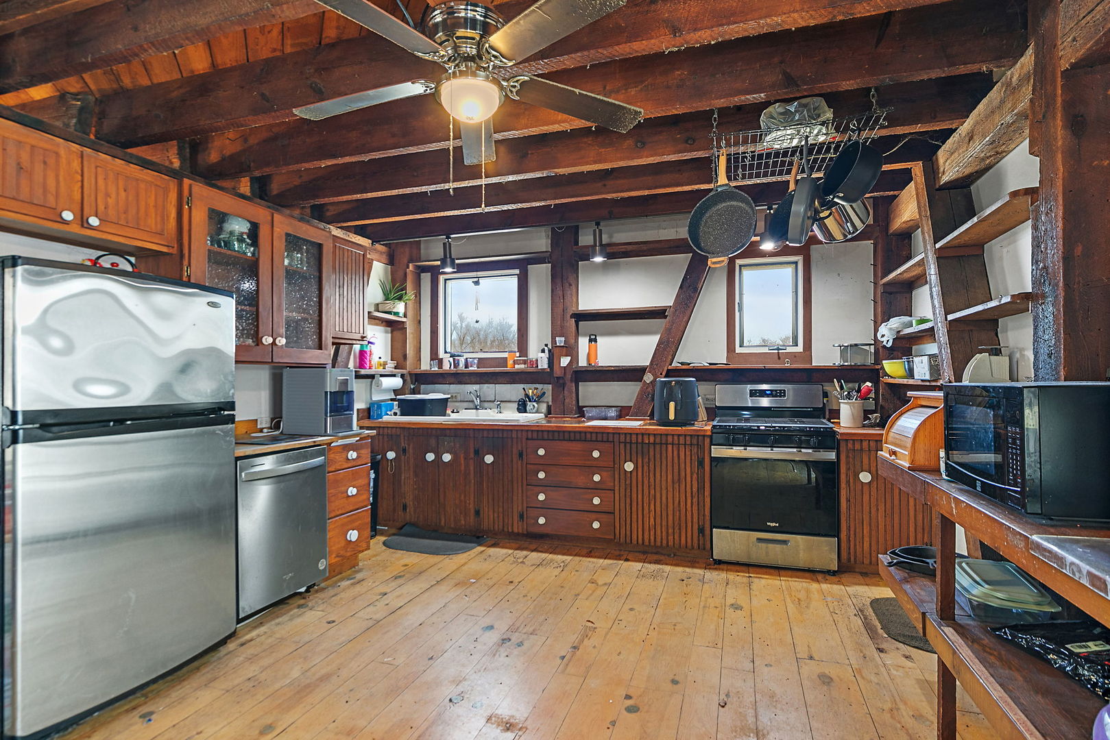 9602 Wright Road Harvard, IL 60033 - Photo 4 of 26 a kitchen with stainless steel appliances granite countertop a refrigerator and a stove