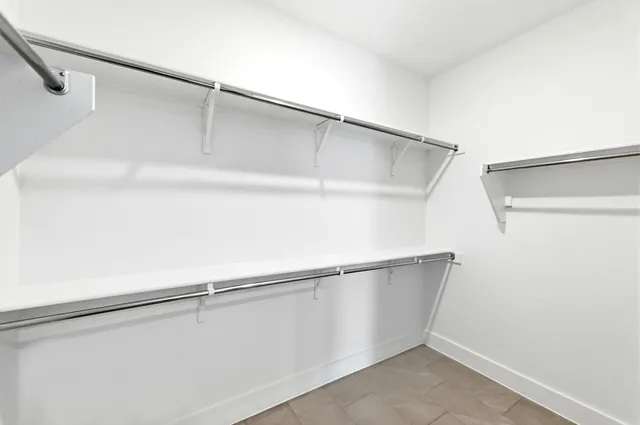 a view of an empty walk in closet