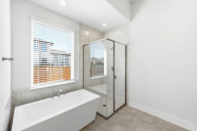 a bathroom with a bathtub and a sink