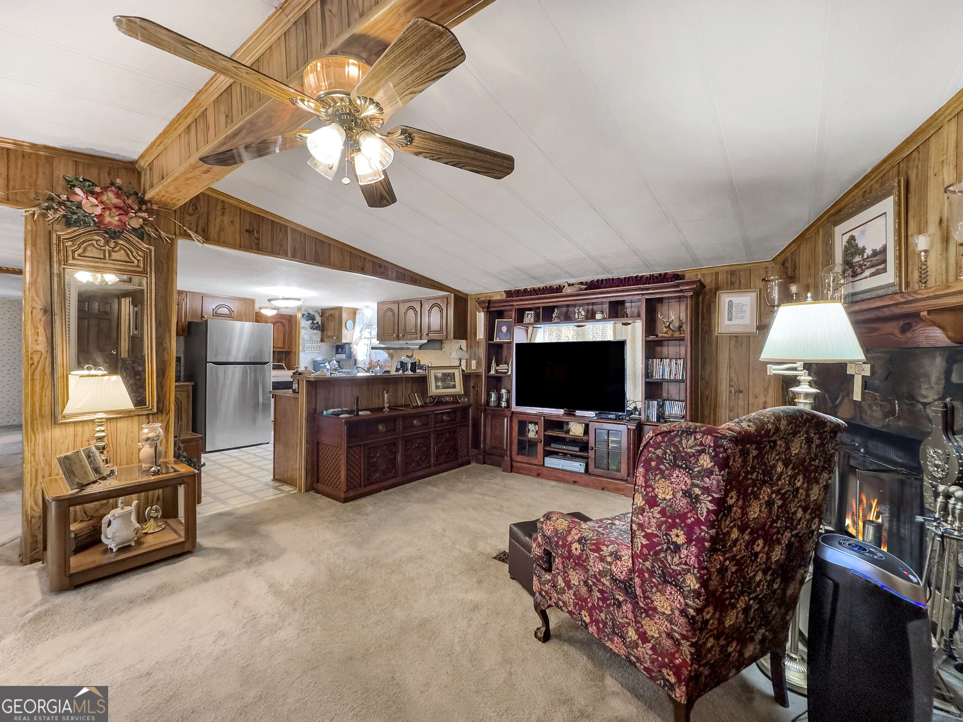 451 Weldon Lake Road Milner, GA 30257 - Photo 13 of 39 a living room with furniture and a flat screen tv