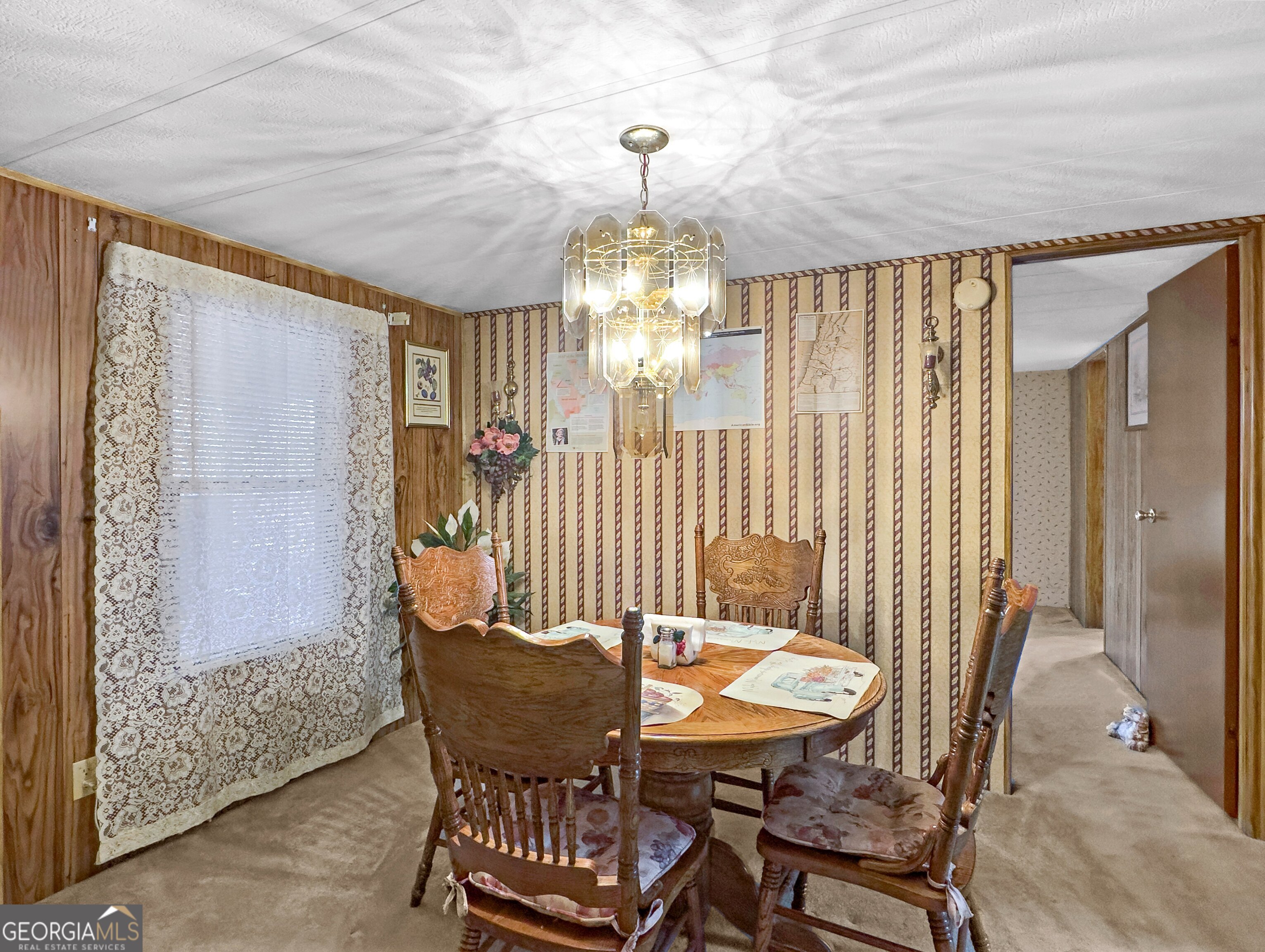 451 Weldon Lake Road Milner, GA 30257 - Photo 14 of 39 a dining room with furniture and window