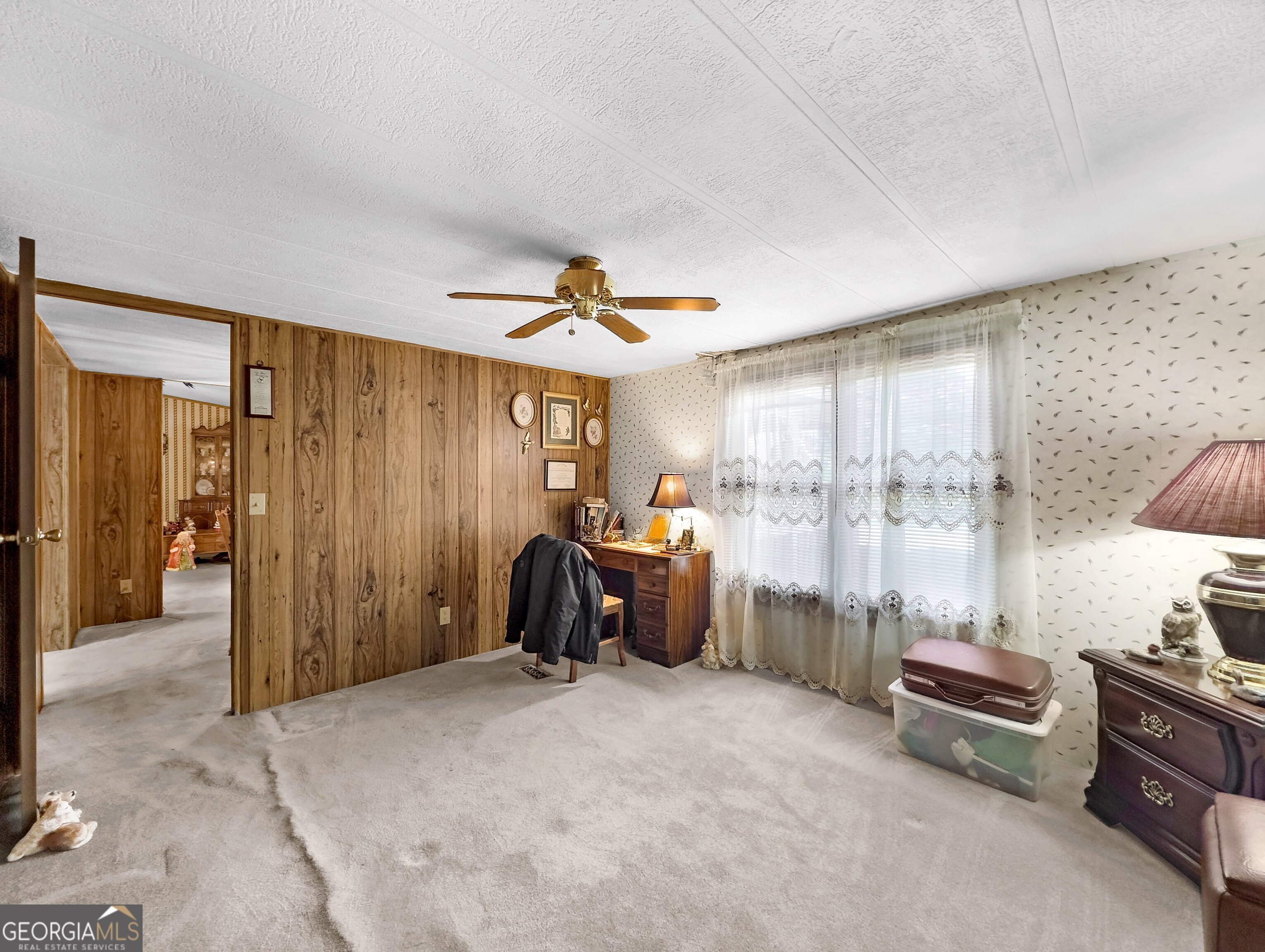 451 Weldon Lake Road Milner, GA 30257 - Photo 17 of 39 a living room with furniture and a window