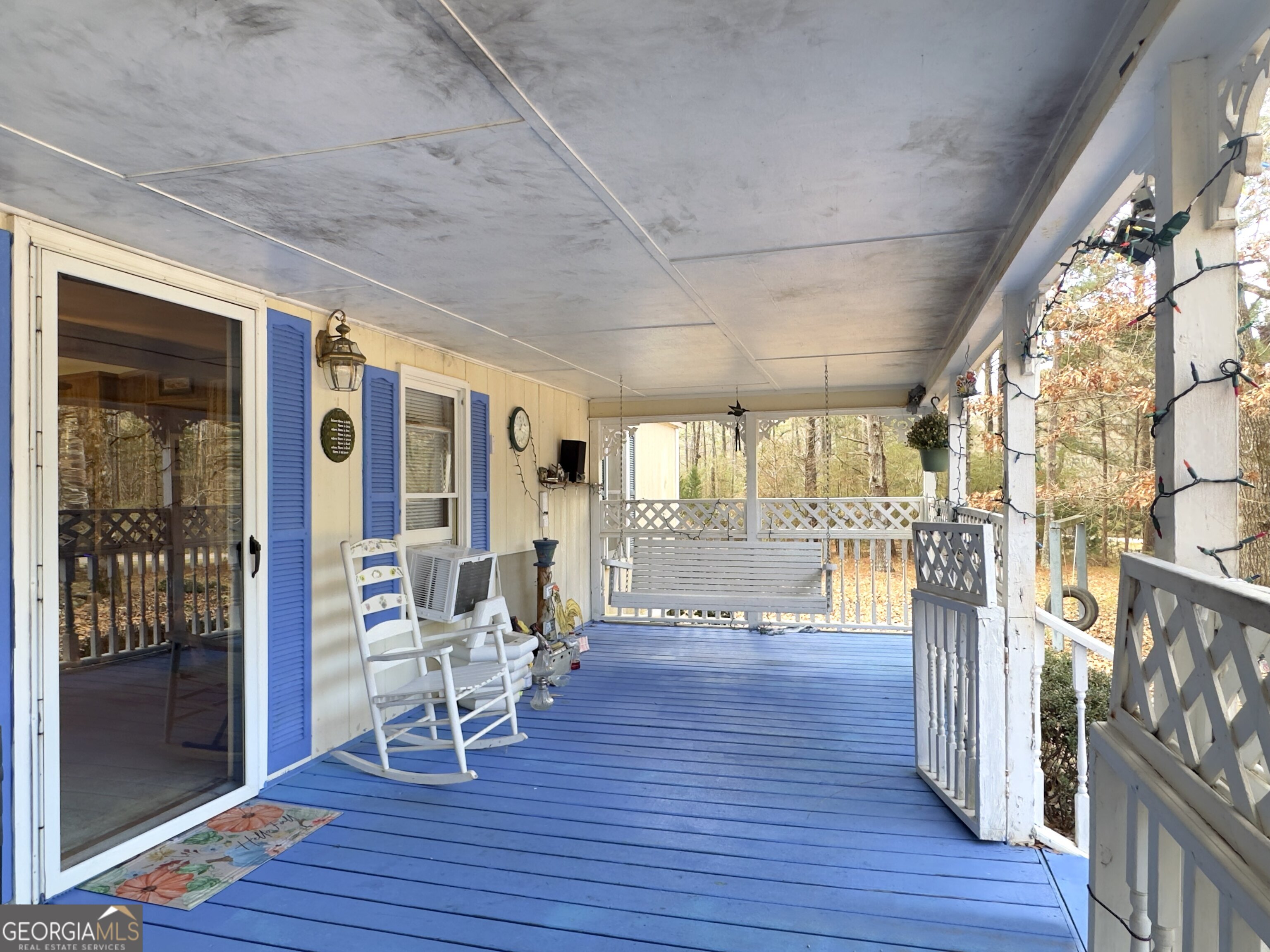 451 Weldon Lake Road Milner, GA 30257 - Photo 31 of 39 a living room with furniture and wooden floor