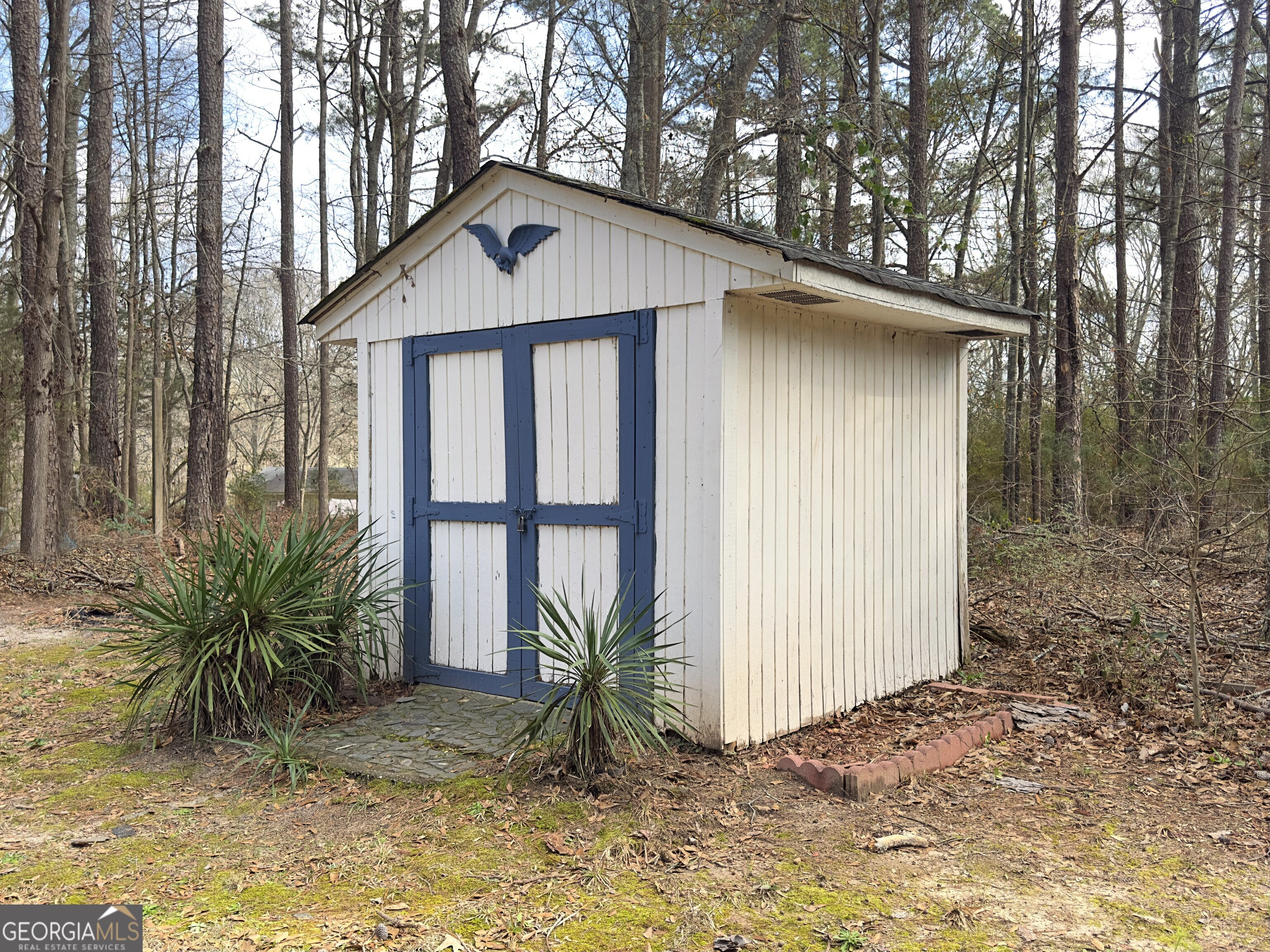 451 Weldon Lake Road Milner, GA 30257 - Photo 38 of 39 a front view of a house with garden