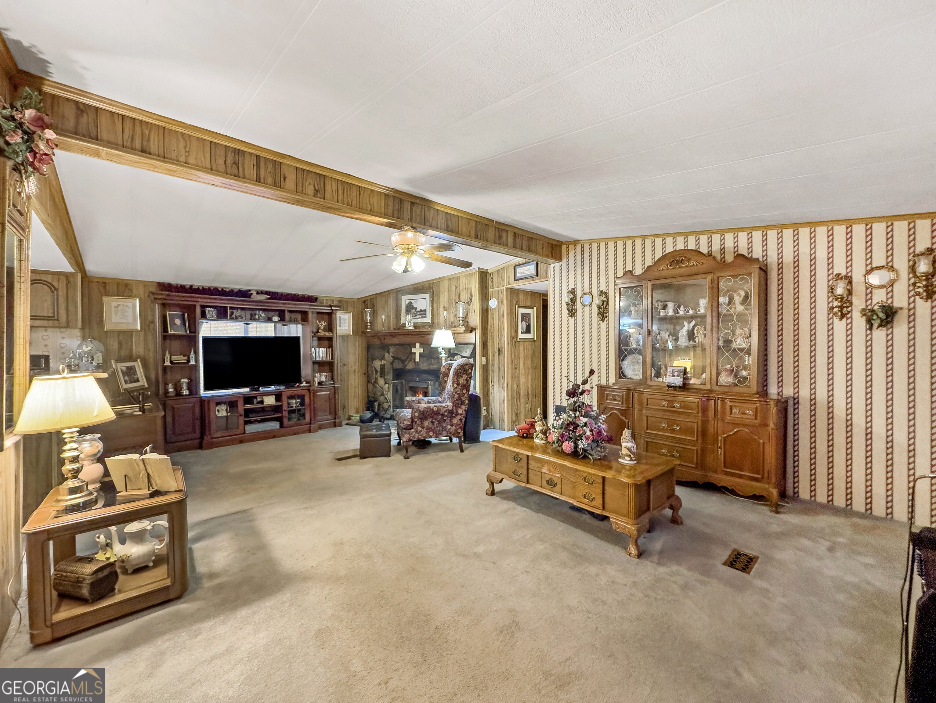 451 Weldon Lake Road Milner, GA 30257 - Photo 9 of 39 a living room with furniture and flat screen tv