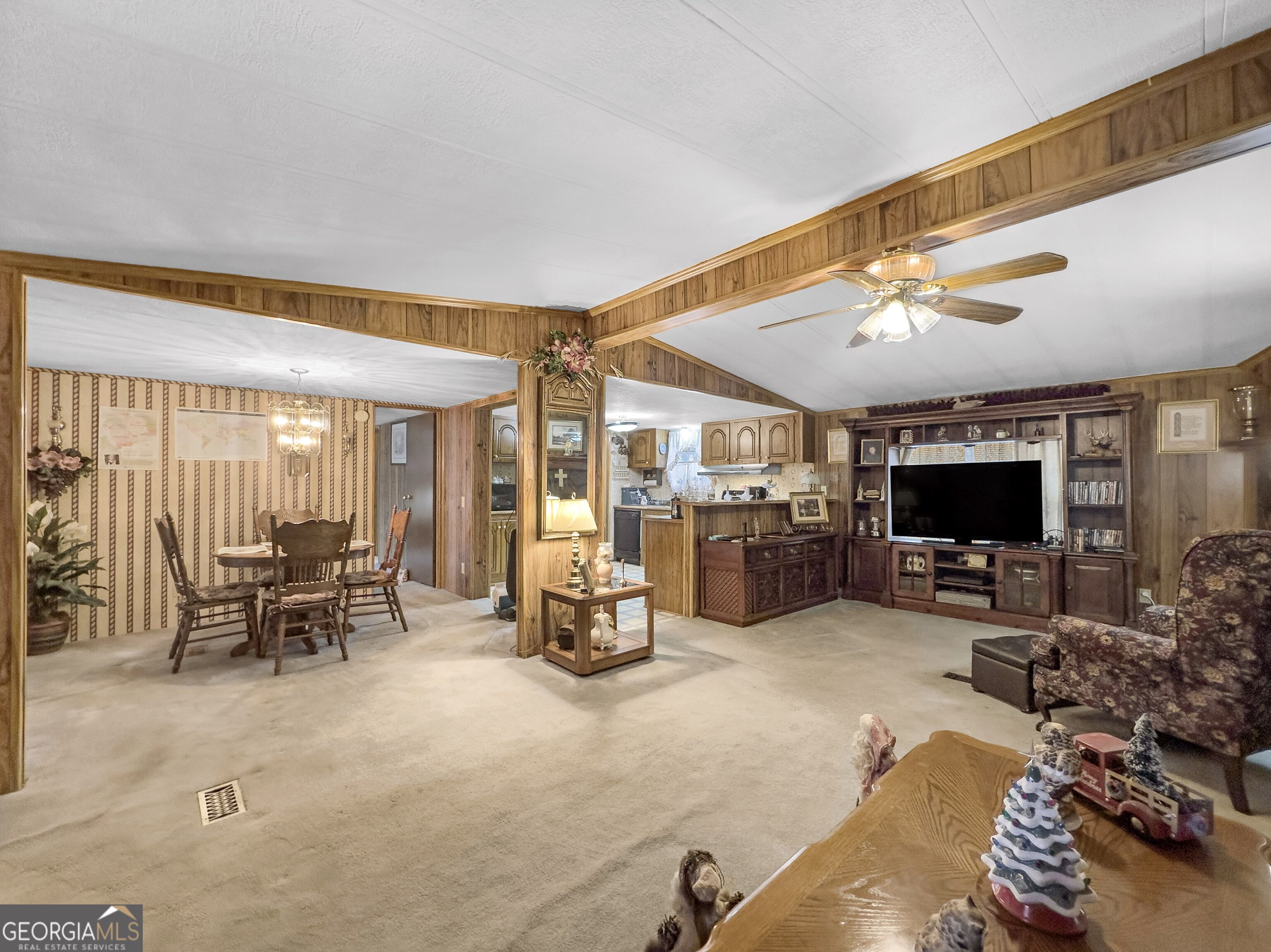 451 Weldon Lake Road Milner, GA 30257 - Photo 10 of 39 a living room with furniture and flat screen tv