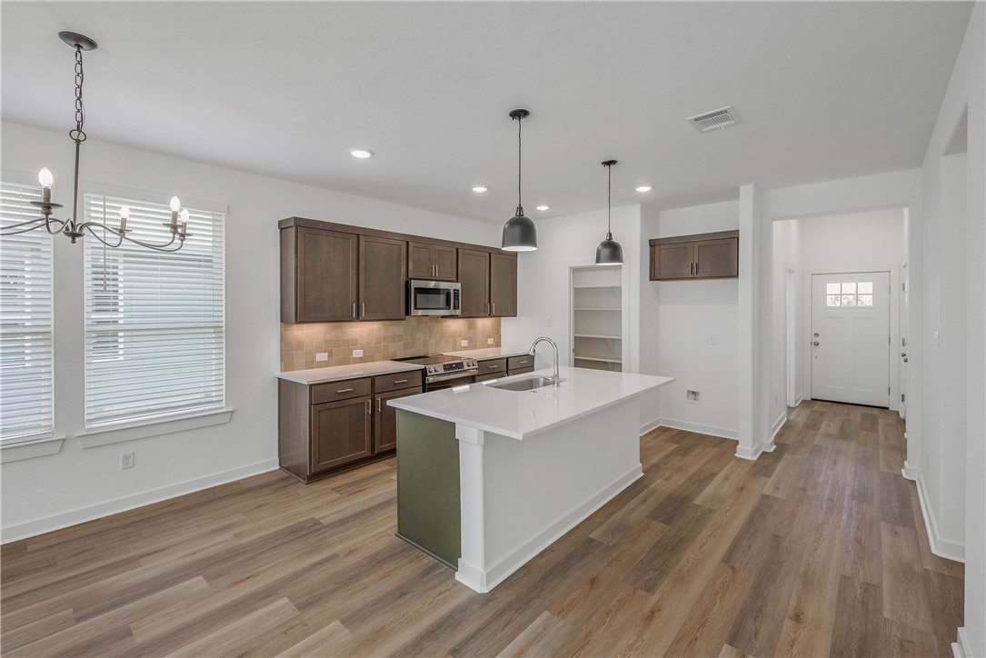 2799 Buccaneer Trail Bryan, TX 77803 - Photo 5 of 16 Photos depict previously completed Emily with elevation B. Selections and finishes may vary; please contact an RNL sales team for the latest information on this home.