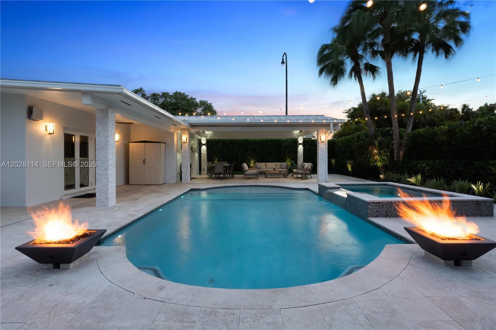 9641 Southwest 66th Street Miami, FL 33173 - Photo 51 of 57 a view of a swimming pool with a patio