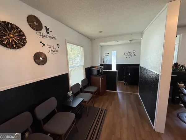 a workspace with furniture and wooden floor