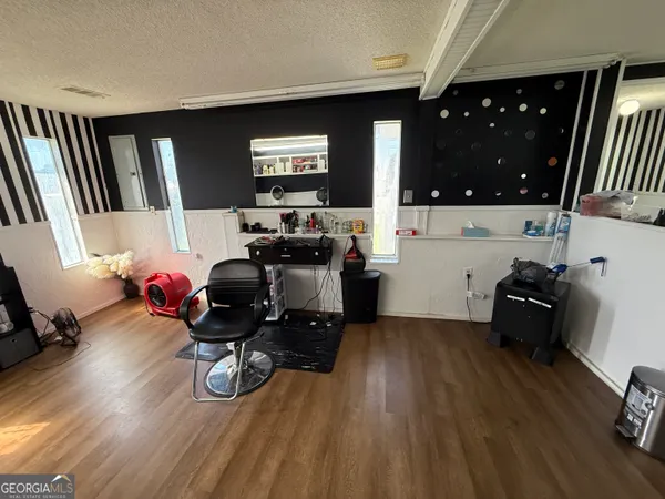 a room with furniture and a flat screen tv