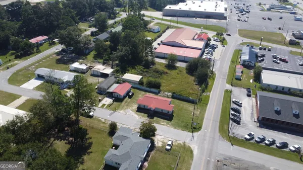 an aerial view of residential houses with outdoor space
