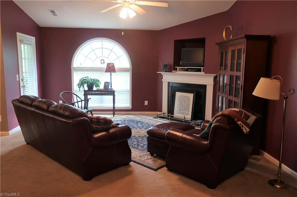 160 James Road, Unit 3B High Point, NC 27265 - Photo 3 of 18 Spacious living room with arched window, fireplace w/gas logs, and vaulted ceiling
