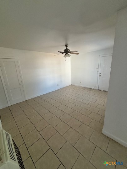 805 West Kern Road, Unit 807 Killeen, TX 76541 - Photo 2 of 4 an empty room with a empty space and a ceiling fan