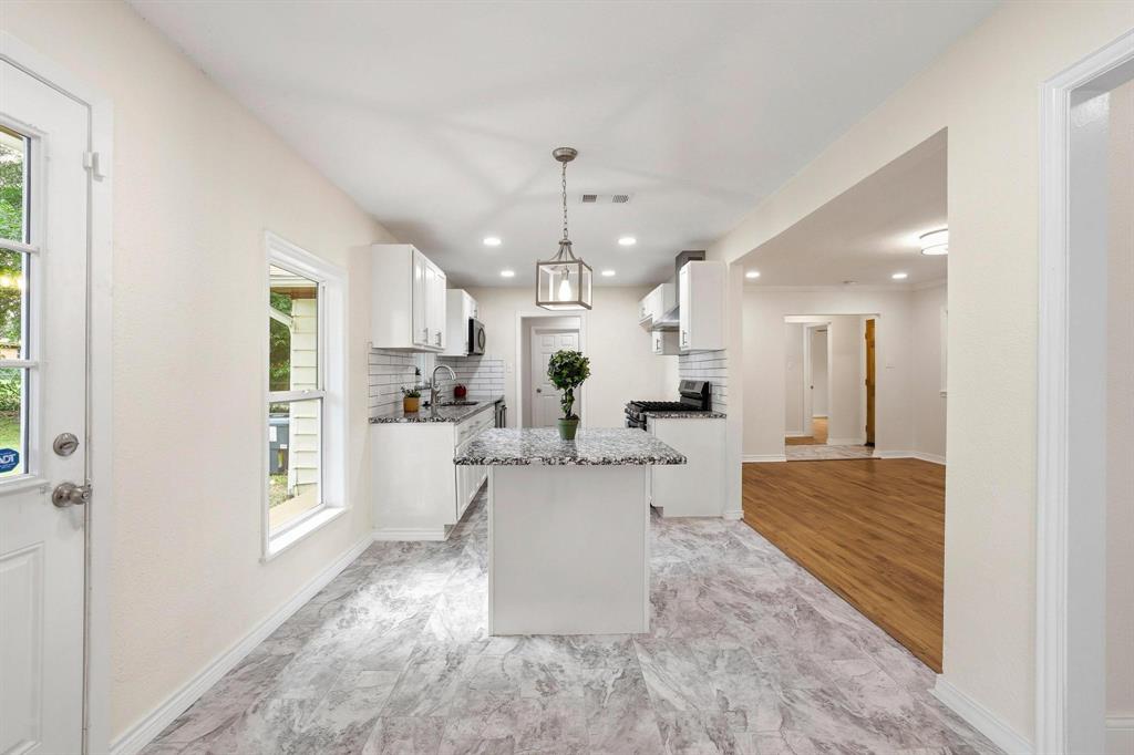 2401 Sunset Street Denison, TX 75020 - Photo 11 of 30 a view of kitchen with dining table and chairs