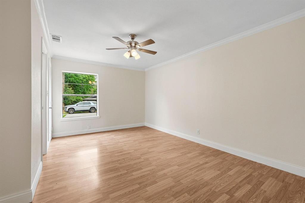 2401 Sunset Street Denison, TX 75020 - Photo 15 of 30 a view of an empty room with a window