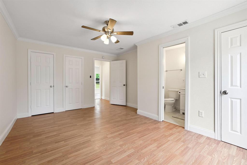 2401 Sunset Street Denison, TX 75020 - Photo 16 of 30 a view of an empty room with wooden floor