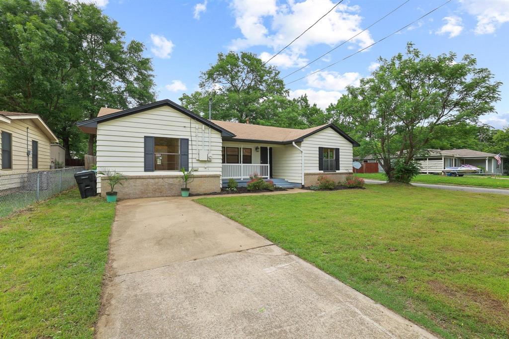 2401 Sunset Street Denison, TX 75020 - Photo 2 of 30 a front view of house with yard and green space
